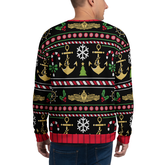 Person wearing a festive sweater with nautical-themed patterns on a white background