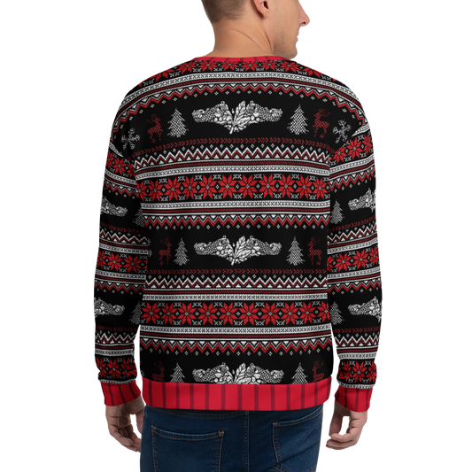 Person wearing a festive sweater with red, black, and white pattern on a white background