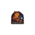 Sticker with a cat character holding a coffee cup and text 'The Brew Oracle' on a white background