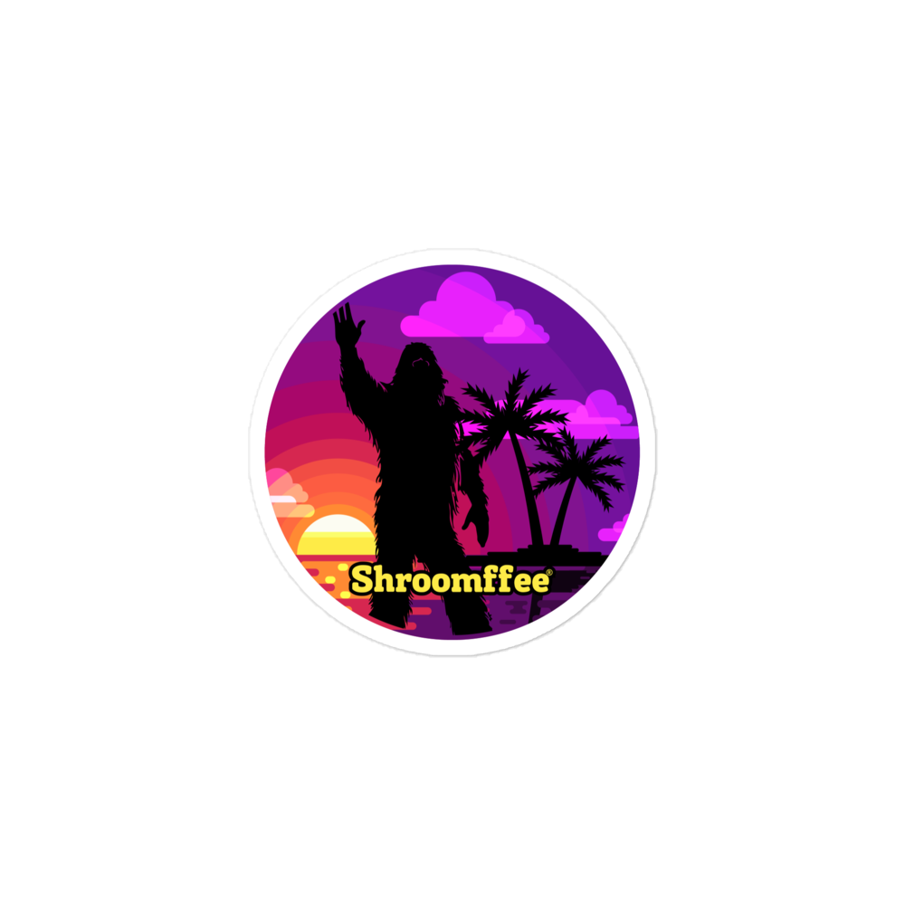 Circular sticker with a silhouette of a person, palm trees, and a sunset with 'Shroomffee' branding.