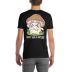 Person wearing a black t-shirt with a cartoon mushroom character and text on the back.