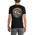 Person wearing a black t-shirt with a circular graphic design on the back