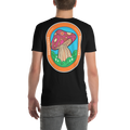 Black t-shirt with a colorful mushroom graphic on the back, worn by a person.