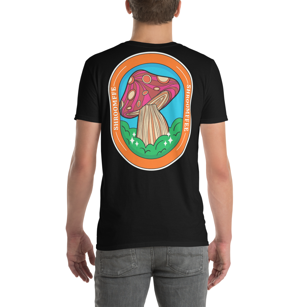 Black t-shirt with a colorful mushroom graphic on the back, worn by a person.