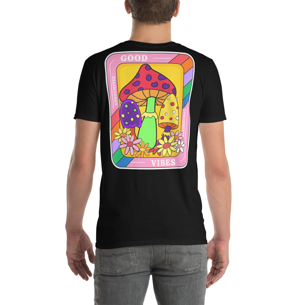 Black t-shirt with colorful mushroom design on the back, worn by a person.