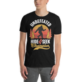 Person wearing a black t-shirt with a graphic design featuring a silhouette of a person in a forest and text.