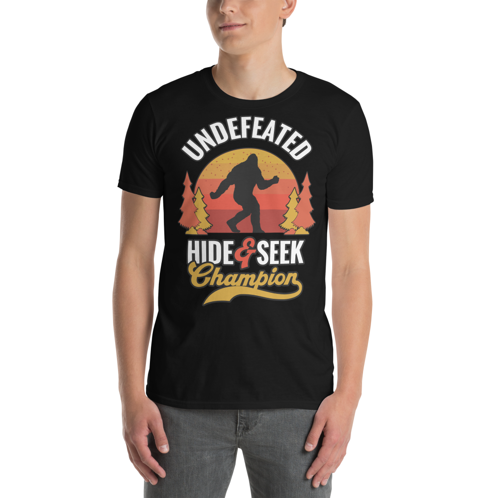 Person wearing a black t-shirt with a graphic design featuring a silhouette of a person in a forest and text.