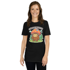 Person wearing a black t-shirt with a cartoon character and mushroom graphic on a white background