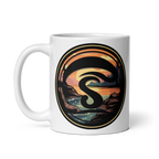White mug with a decorative design featuring a stylized letter 'S' and landscape.