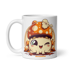 White mug with a cartoon mushroom design on a white background