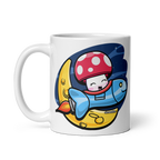White mug with a colorful cartoon design featuring a mushroom character on a white background