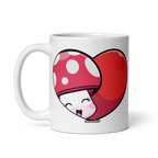 White mug with a red heart-shaped mushroom design on a white background