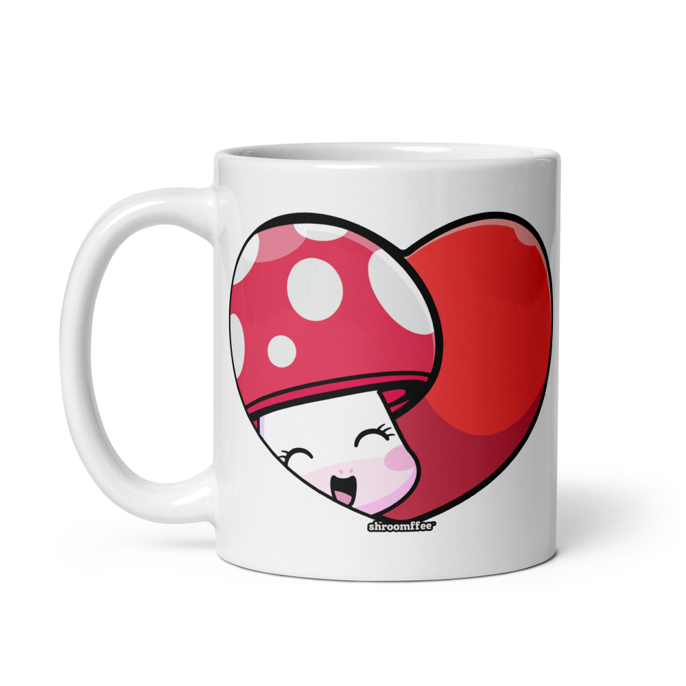 White mug with a red heart-shaped mushroom design on a white background