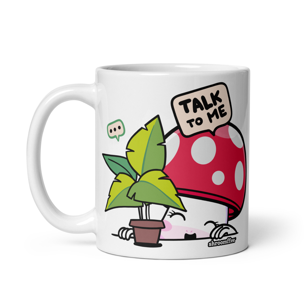 Mug with cartoon mushroom and plant design on a white background