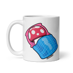 White mug with pink and blue mushroom design on a white background