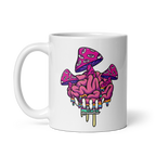 White mug with a colorful mushroom and brain design on a white background