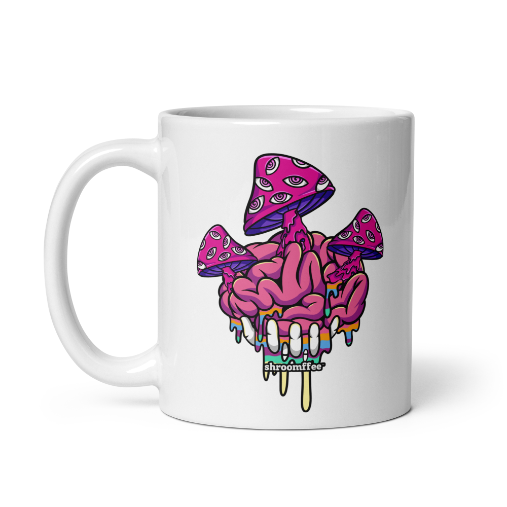 White mug with a colorful mushroom and brain design on a white background