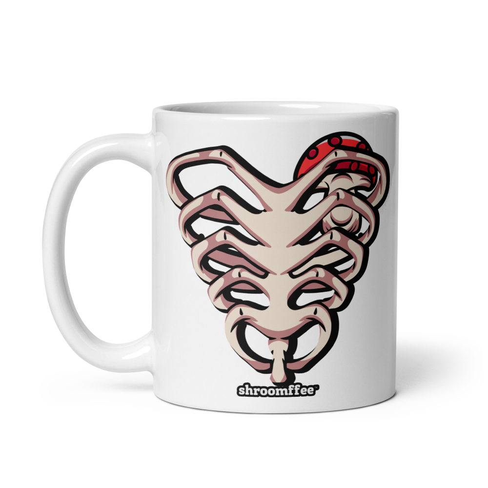 White mug with a graphic design of a snake on ribcage and 'shroomffee' branding on a white background