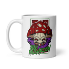 Mug with a graphic design of a mushroom with a face on a white background