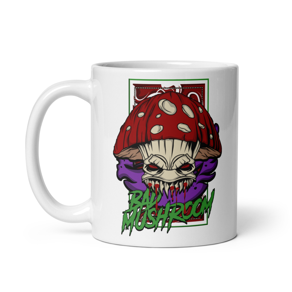Mug with a graphic design of a mushroom with a face on a white background