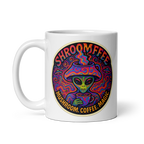 White mug with a colorful alien design and text on a white background