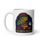White mug with a colorful design of a frog and text 'The Brew Oracle' on a white background