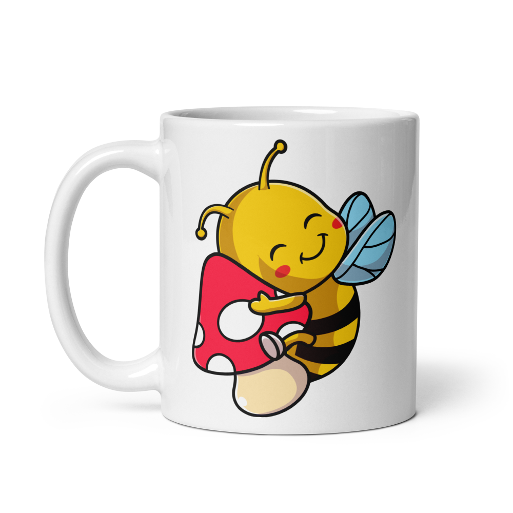 White mug with a cartoon bee holding a mushroom design on a white background