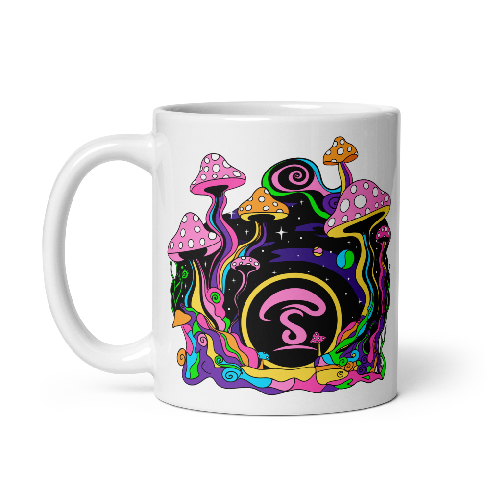 White mug with colorful mushroom design and letter 'S' on a white background