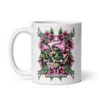 Mug with skull and mushroom design featuring pink flowers on a white background