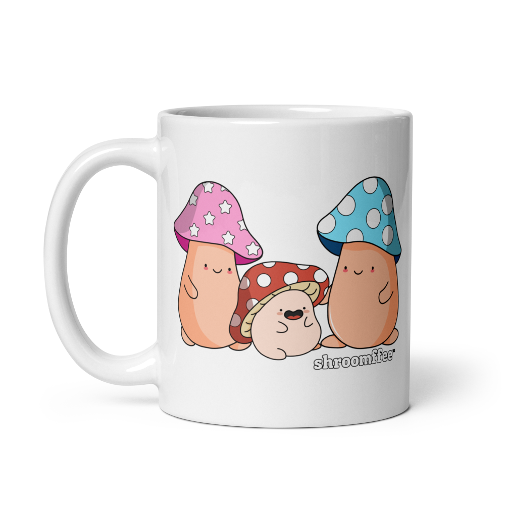 White mug with cartoon characters wearing mushroom hats on a white background