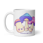 White mug with cartoon mushrooms design and 'SHROOMFFEE' text on a white background