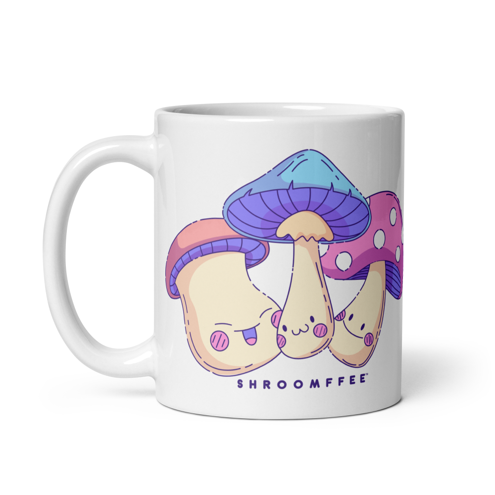 White mug with cartoon mushrooms design and 'SHROOMFFEE' text on a white background