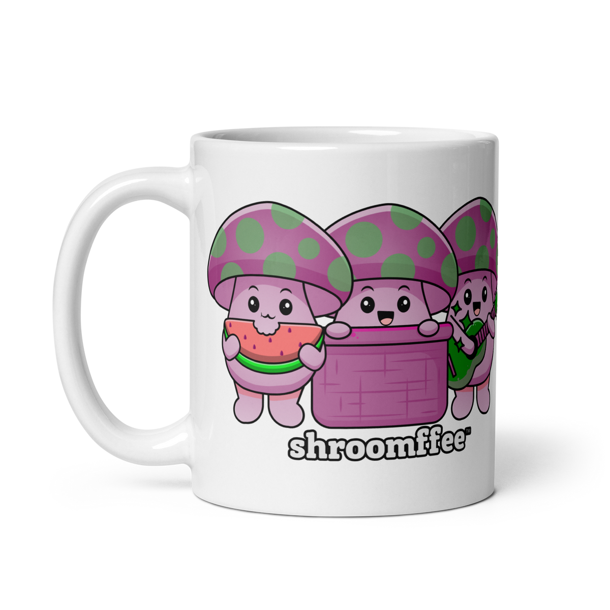 A white ceramic mug with cartoonish mushroom characters in pink and purple colors, with the word 'shroomies' written on it.