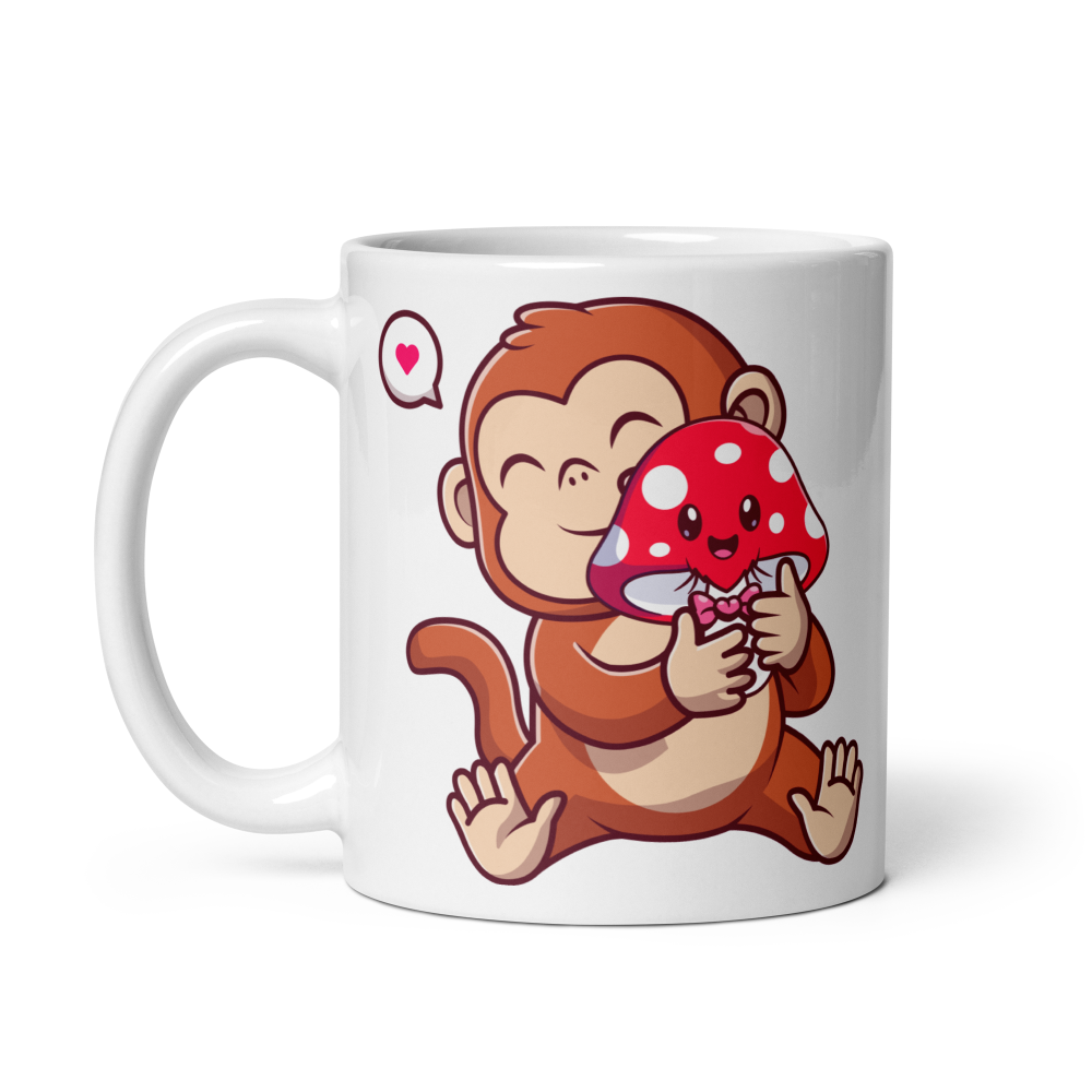 White mug with a cartoon monkey holding a red mushroom with white spots design on a white background