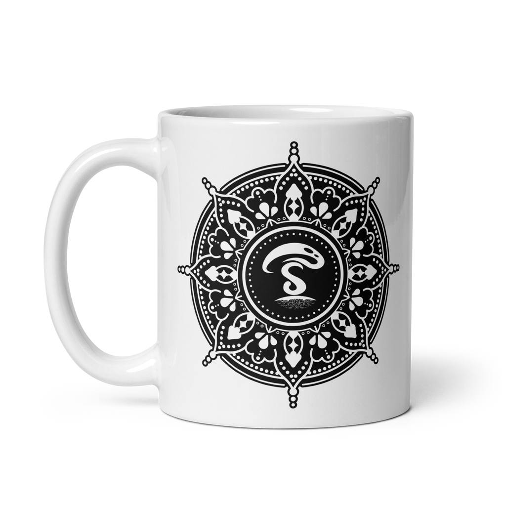 White ceramic mug with a black-and-white mandala design and a central insignia.