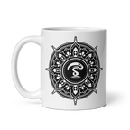 White ceramic mug with a black-and-white mandala design and a central insignia.