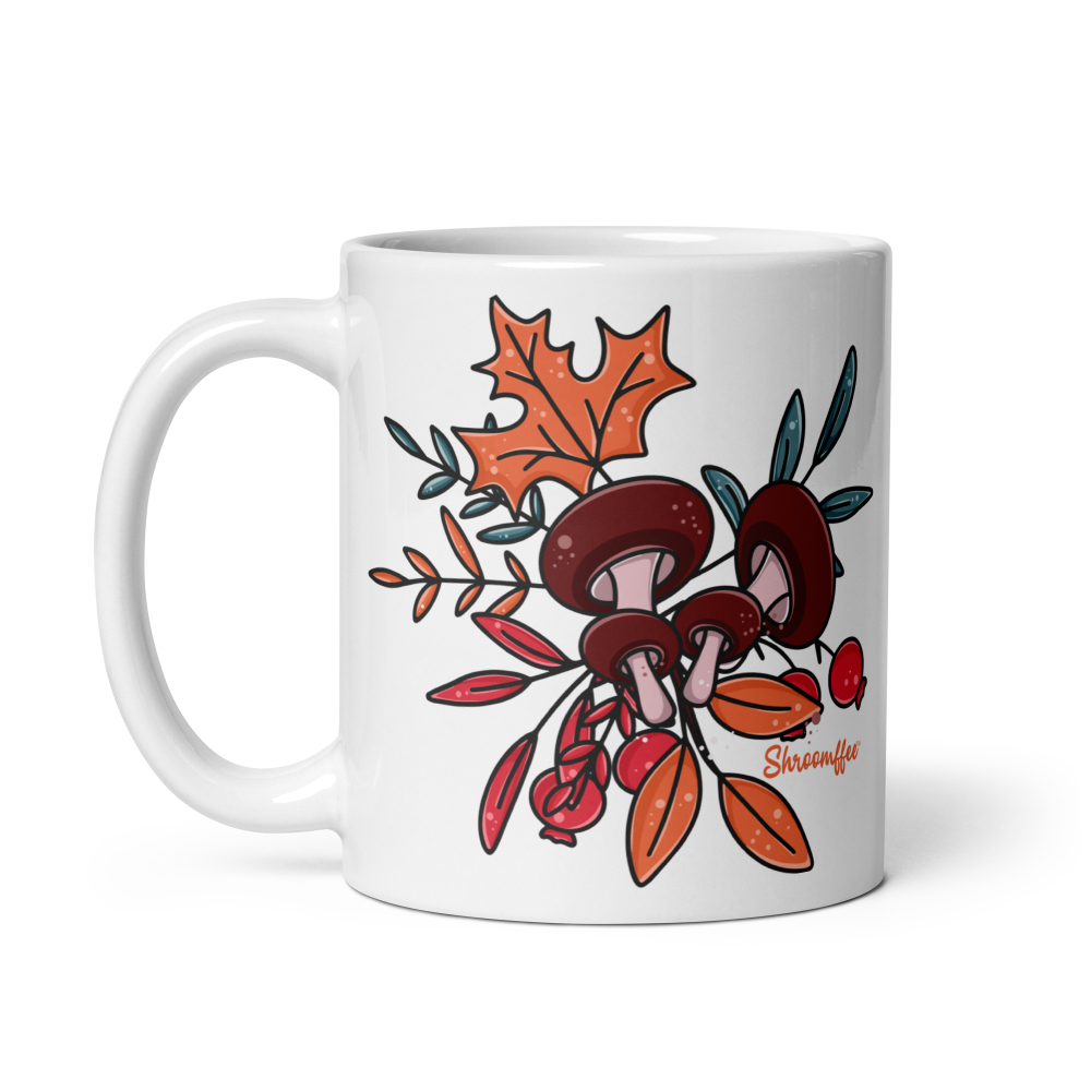 White mug with mushroom and leaf design on a white background