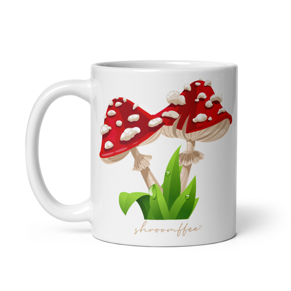 White mug with red mushroom design and 'shroomoffee' text on a white background
